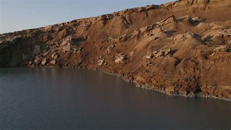 Aerial video of sinkholes emerging as Dead Sea 4K Stock Footage Video | World Footage