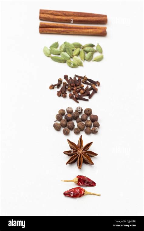 Set Of Dry Spices Are Laid Out In Row On Table Red Pepper Pods Star