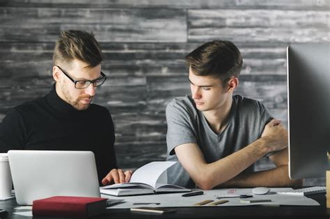 Premium Photo Concentrated Men Doing Paperwork