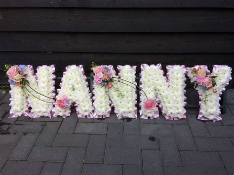 Flowers Are Placed In The Letters That Spell Outi Love Yous Name