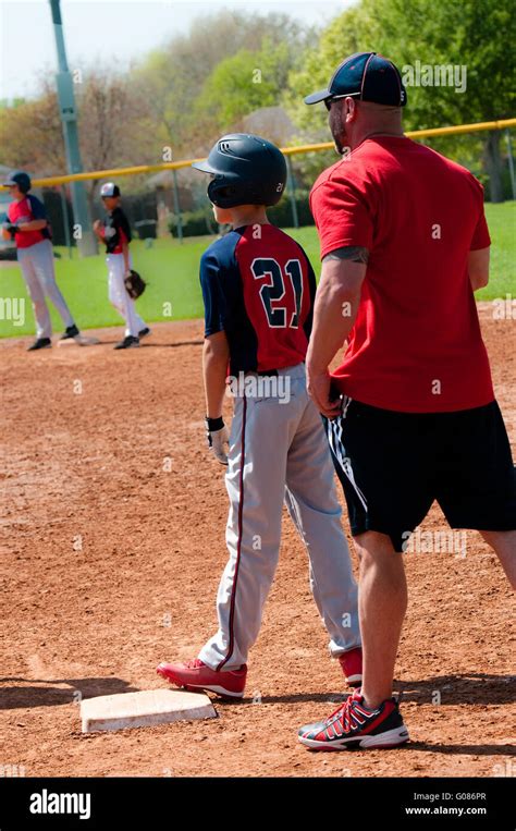 Teen Baseball Player And Coach Stock Photo Alamy