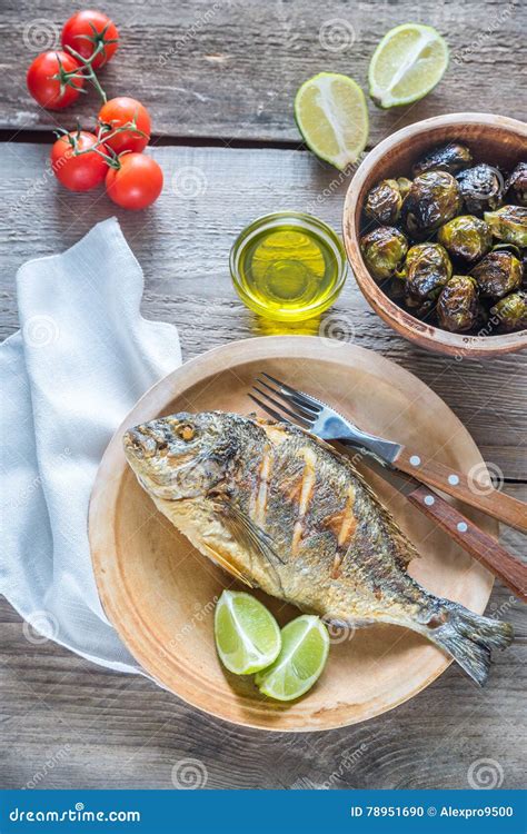 Grilled Dorade Royale Fish With Fresh And Baked Vegetables Stock Photo