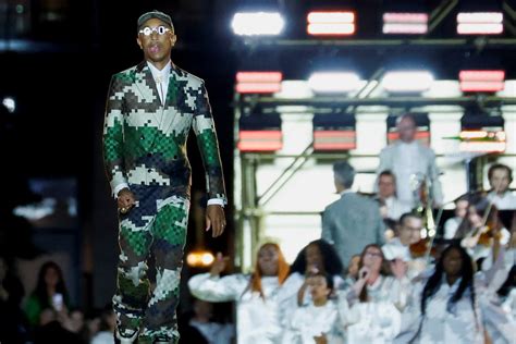 Pharrell Williams stages Louis Vuitton debut on Pont Neuf | Reuters