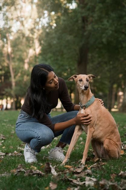 Free Photo | Full shot woman petting dog