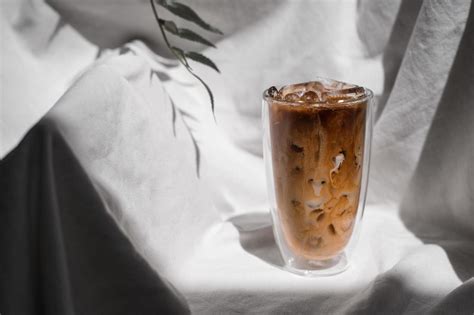 Close Up Glass Of Iced Coffee With Milk On The Table 2289428 Stock