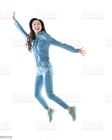 Excited Woman Jumping On White Background Stock Photo Download Image