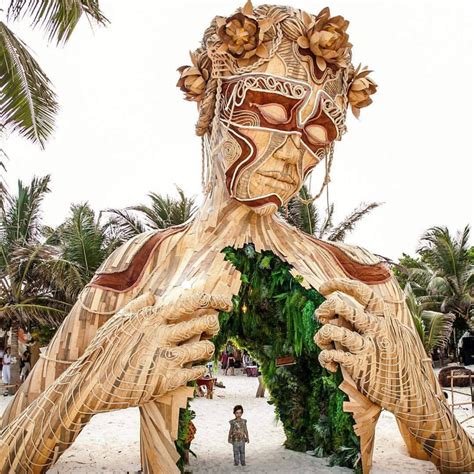 A Towering Wooden Sculpture By Daniel Popper Welcomes Beachgoers In