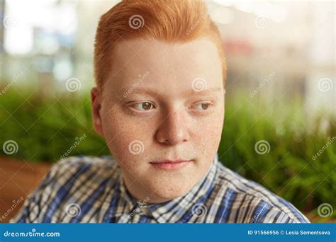 Close-up Portrait of a Boy with Round Face and Many Freckles with Brown ...