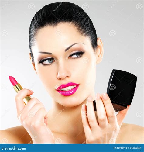 Beautiful Woman Applying Pink Lipstick On Lips Stock Photo Image Of