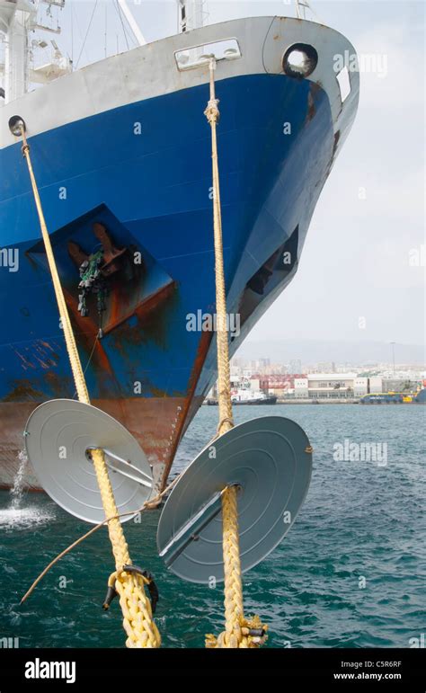 Rat guards on ship mooring ropes to prevent Rats getting aboard Stock ...