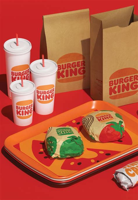 Burger King S Breakfast Items Are Displayed On An Orange Tray With Cups