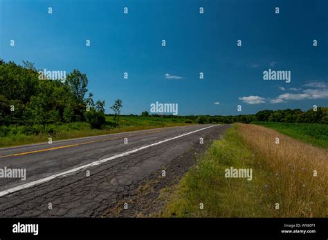 Country Road Going Through The Corn Fields Stock Photo Alamy