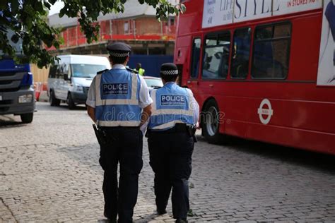 British Police Officers with High Visable Blue Jackets Patrolling ...