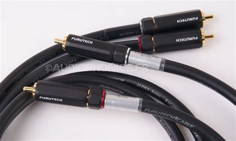 Three Black And Gold Cables Are Shown On A White Surface