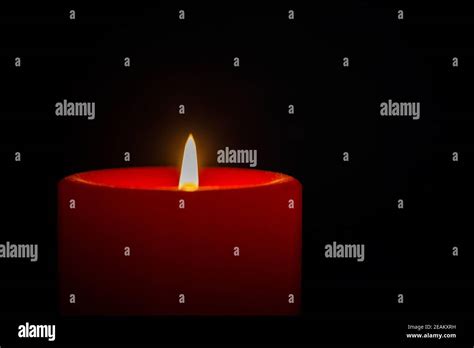 A candle in the dark Stock Photo - Alamy