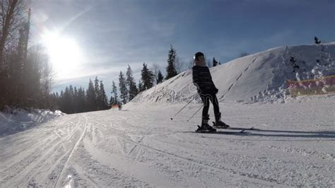 Pov Beginner Girl On Skis And Amateur Skiers Slide Down On Ski Slope At Ski Resort Against The