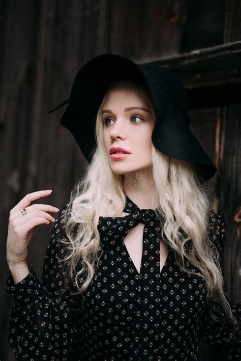 Beautiful Attractive And Stylish Girl Wearing Black Hat Standing Posing In City Nude Makeup