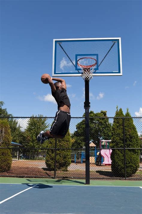 Man Dunking the Basketball stock photo. Image of ball - 10103192