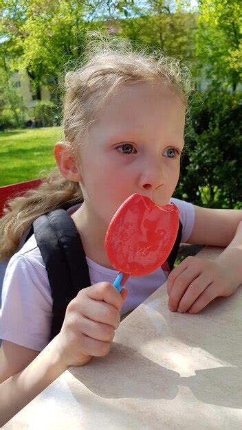 Premium Photo Cute Girl Eating Ice Cream