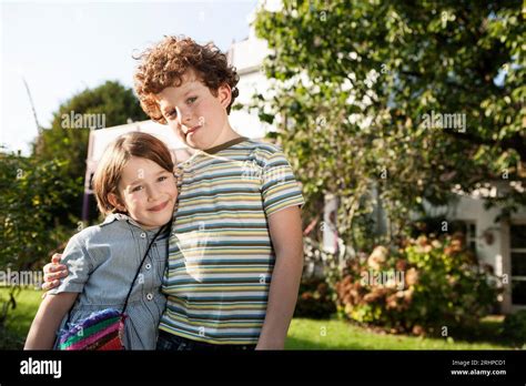 Siblings Pose Outside Home Hi Res Stock Photography And Images Alamy