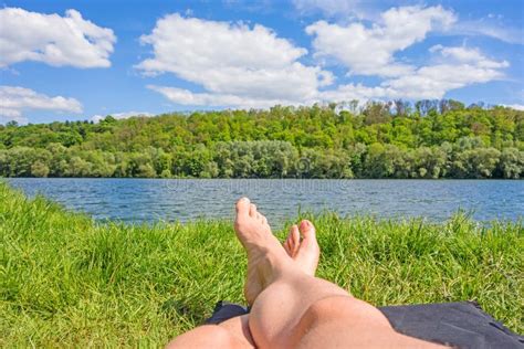 Feet At Lake River Meadow Grass Stock Image Image Of Lying