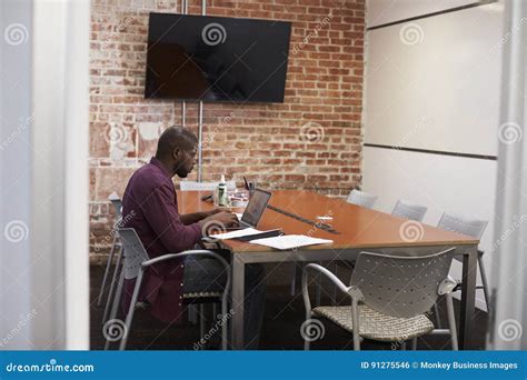 Businessman in Meeting Room Working on Laptop Stock Photo - Image of ...