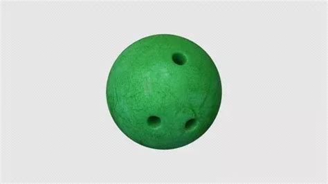 a green plastic ball with holes in it