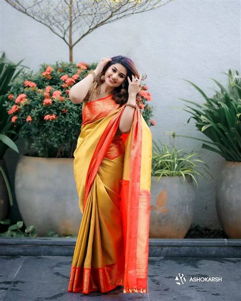 Actress Sneha Prasanna Looks Pretty In A Yellow Silk Saree