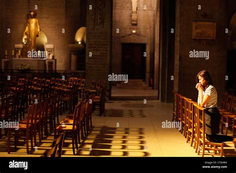 Girl Praying In Church Stock Photo Alamy