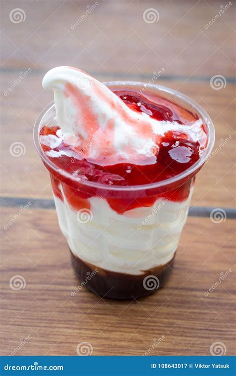 Ice Cream Plastic Cup. Ice Cream with Fruit Syrup Stock Image - Image ...