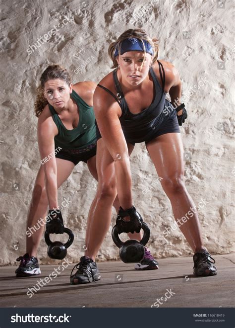 Serious Pair Young Women Lifting Weights Stock Photo 116618419 ...