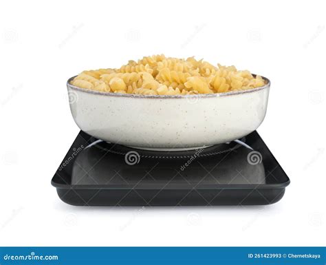 Modern Kitchen Scale With Bowl Of Raw Pasta Isolated On White Stock