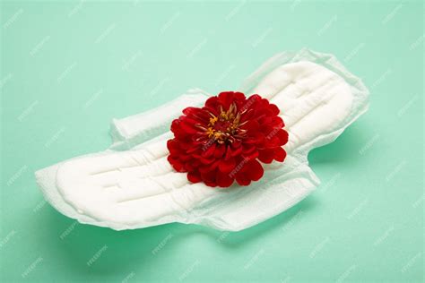 Premium Photo White Sanitary Pad Hygiene Protection On A Mint Background Gynecological