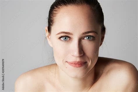 Beauty Brunette Women With Big Blue Eyes And Dark Eyebrows Looking At Camera And Smiling Model