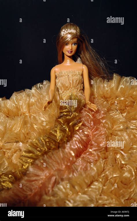 Barbie Doll In Long Golden Dress Stock Photo Alamy