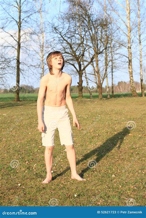 Barefoot Boy Standing On Grass Stock Image | CartoonDealer.com #52621723