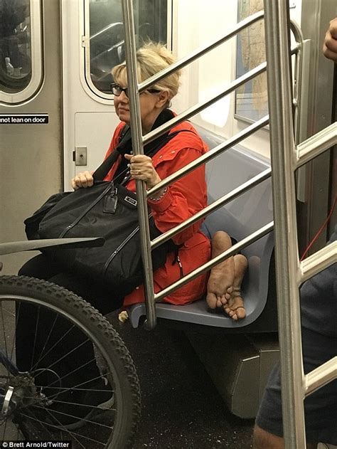 Woman Sits On Homeless Mans Bare Feet On New York Subway Daily Mail