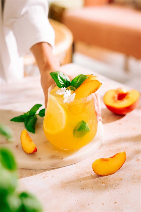 Best Bourbon Peach Cocktail With Ginger And Basil The Social Sipper