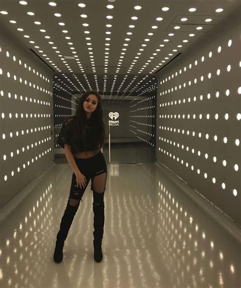 Maggie Lindermann Ripped Black Jeans With Fishnet Tights Thigh High Black Boots Long Brunette