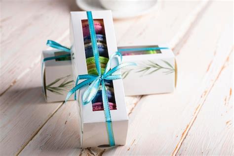 Premium Photo Colorful Macaroons In A Box On A Light Wooden Table Closeup