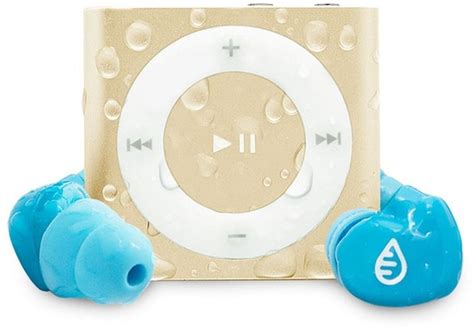 an ipod with earbuds sitting next to it's case and two blue balls