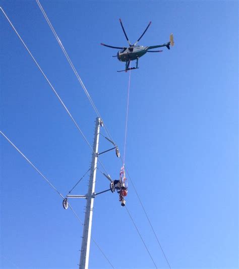 lineman working on power lines helicopter - DH-NX Wiring Diagram