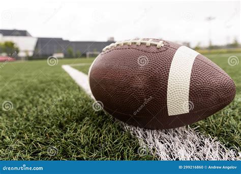 Leather Football on a Football Field. High Quality Photo Stock Photo ...