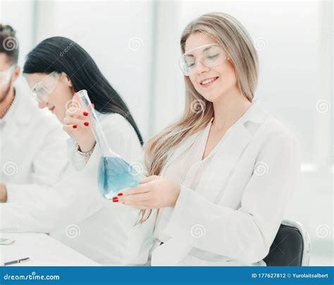 Group Of Scientists Conduct Research In The Laboratory Stock Photo