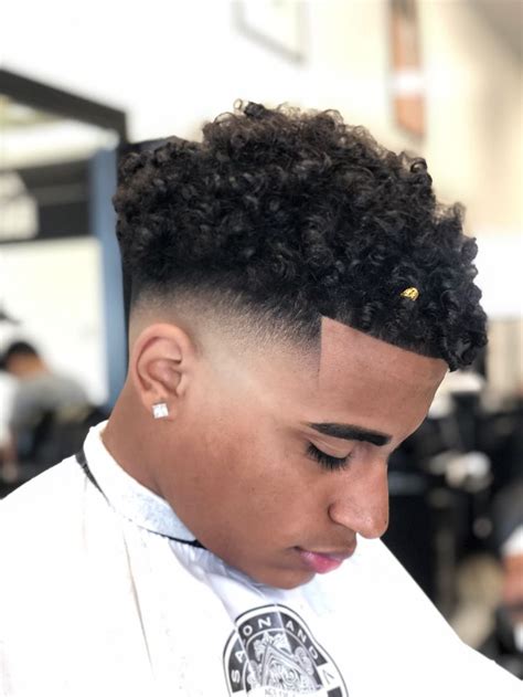 Low Fade With Curls And Gold Bead Haircuts For Curly Hair Black