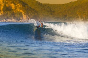 Indonesia, Lombok, surfing man stock photo