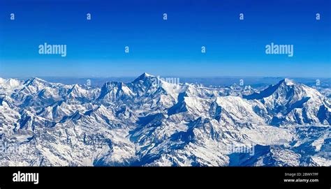 Aerial view of Mt. Everest (center) and Himalaya Range on flight from ...