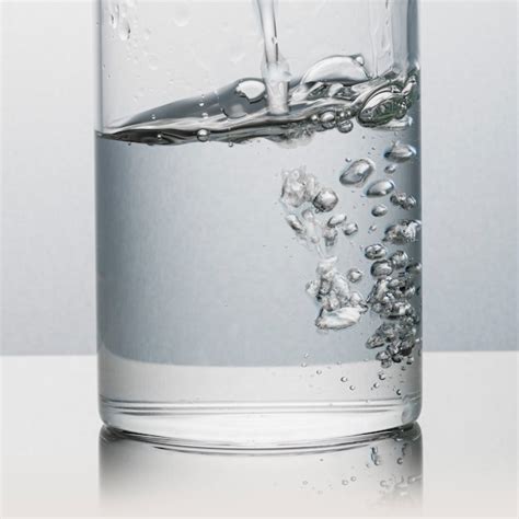 Premium Photo Pouring Water Into A Glass