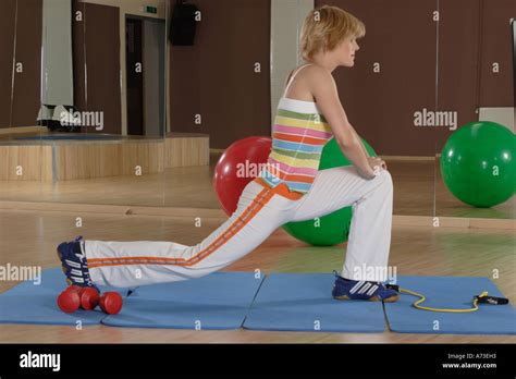 Blonde Woman Stretches Muscles Stock Photo Alamy