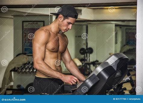 Shirtless Young Man Running On Treadmill In Gym Stock Photo | CartoonDealer.com #83177784